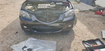 6 849 р. Передний бампер TYG (без отверстий под омыватели, 1.6L/2.0L)  Mazda 3/Axela  BK (2003-2006) дорестайлинг седан (Неокрашенный)  с доставкой в г. Вологда. Увеличить фотографию 2