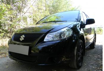 2 899 р. Защита радиатора Стрелка11 Стандарт Suzuki SX4 GYC21S дорестайлинг седан (2006-2012) (черная)  с доставкой в г. Вологда. Увеличить фотографию 2